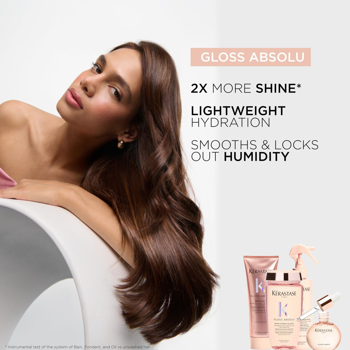 KÉRASTASE applying drops to hair lengths illustrating frizz control benefit