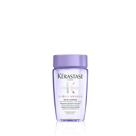 KÉRASTASE front packaging travel-size bottle showing brand and product benefits