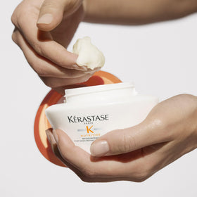 KÉRASTASE Masquintense rinsing from hair in salon setting demonstrating easy detangling