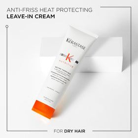 KÉRASTASE Nectar Thermique staged in bathroom styling setup suggesting salon-quality routine