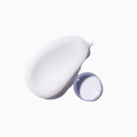 KÉRASTASE Therapiste bottle held in hand illustrating product size
