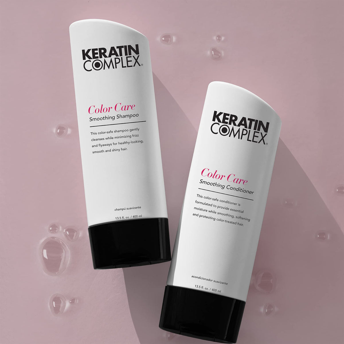 Keratin Complex bottle held next to hand for size comparison emphasizing large 33.8 oz value for frequent use