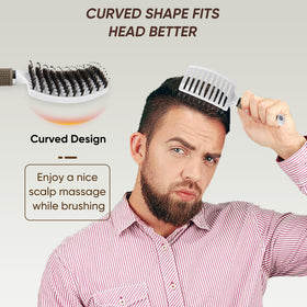 Kertiberif brush held in hand to show scale and comfortable grip advantage