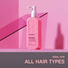 KEVIN.MURPHY applying BODY.MASS to damp hair for improved volume and manageability