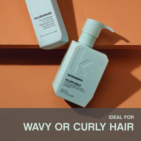 Applying KEVIN.MURPHY cream to damp curls for instant definition benefit