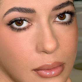 Kevyn Aucoin curler positioned at eye demonstrating precise placement for natural lift