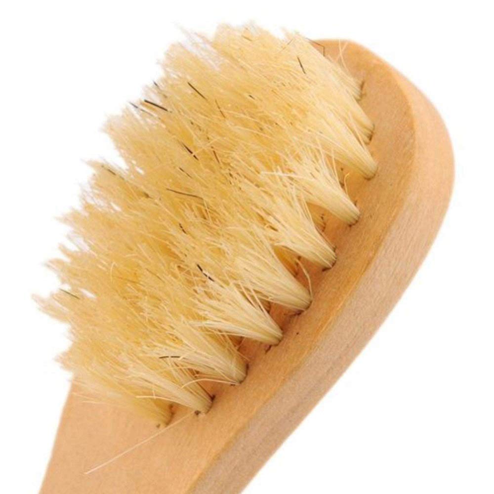 KEWLYSEU brush held in hand to show scale and precise control for targeted facial cleansing