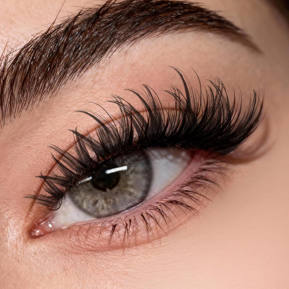 KEYYOU lifestyle model wearing fluffy volume lashes showing salon-style confidence