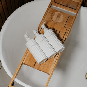 KIBAGA dispensers on shower shelf demonstrating tidy, spa-like atmosphere