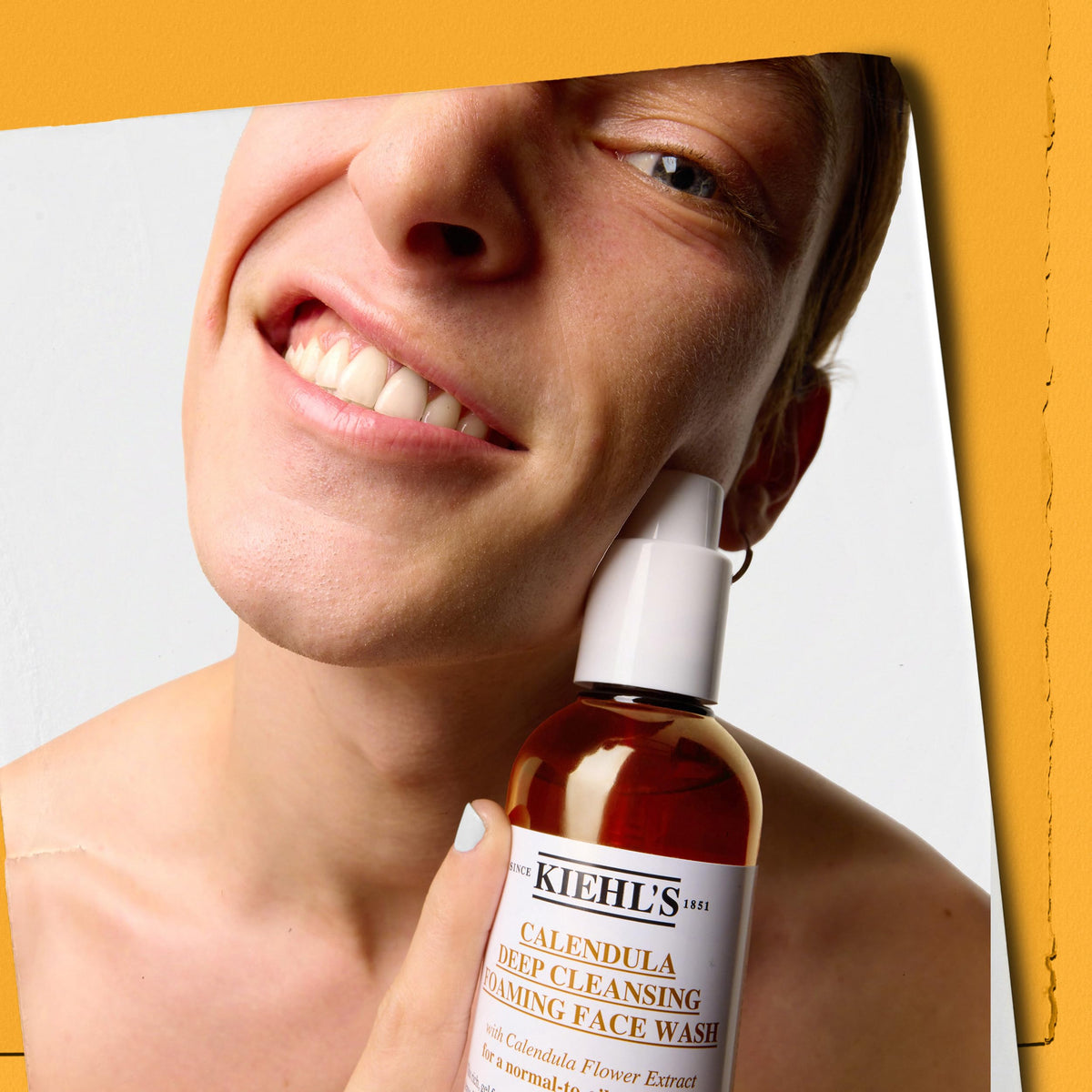 Kiehl's size comparison next to hand indicating bottle scale