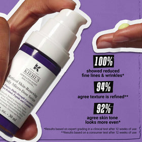 Close-up drops of Kiehl's serum texture, shows lightweight hydrating finish