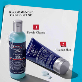 Kiehl's set held in hand to show size and travel-friendly convenience benefit