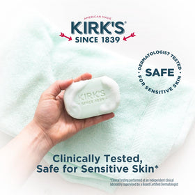 Hand lathering Kirk's soap to show rich foam and gentle skin cleansing action