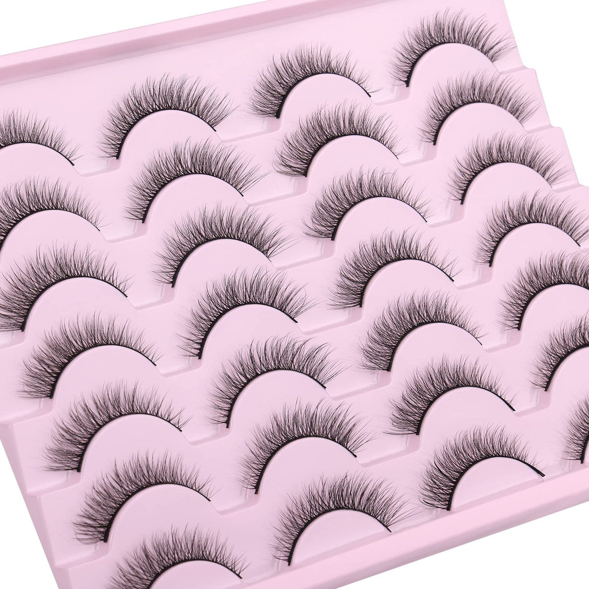 Kiromiro lashes next to a coin, scale comparison for short 10mm length