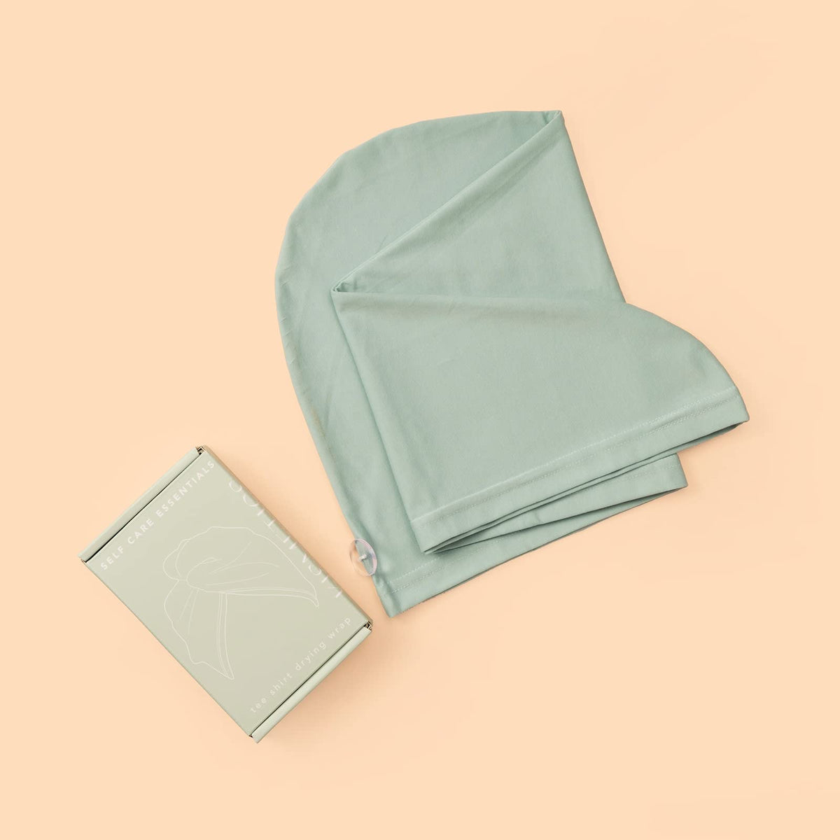 KISMETICS turban next to common items showing true size and hair capacity