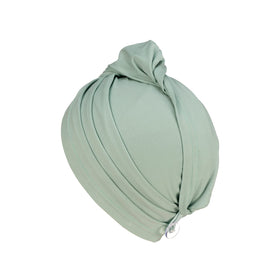 KISMETICS button and elastic loop detail ensuring secure fit during movement