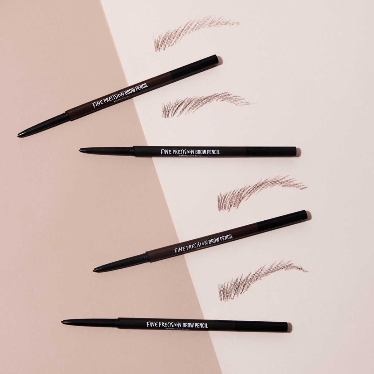 Kiss brow pencil held in hand showing slim size and travel-friendly benefit