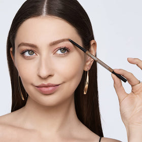 Kiss brow pencil spoolie detail demonstrating blending and grooming benefit