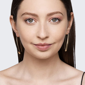 Kiss brow pencil swatches on arm showing shade depth and blending options
