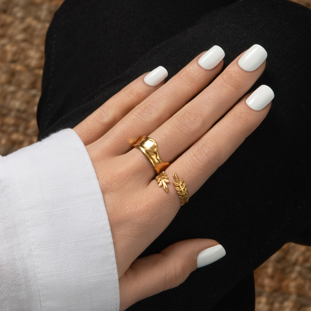 KISS nails in hand demonstrating Frosting squoval short fit and instant polished look
