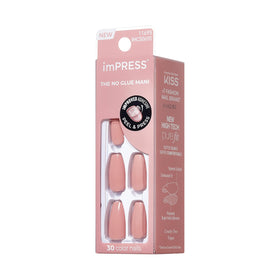 KISS press-on nail next to a coin to show scale and fit options for varied nail sizes