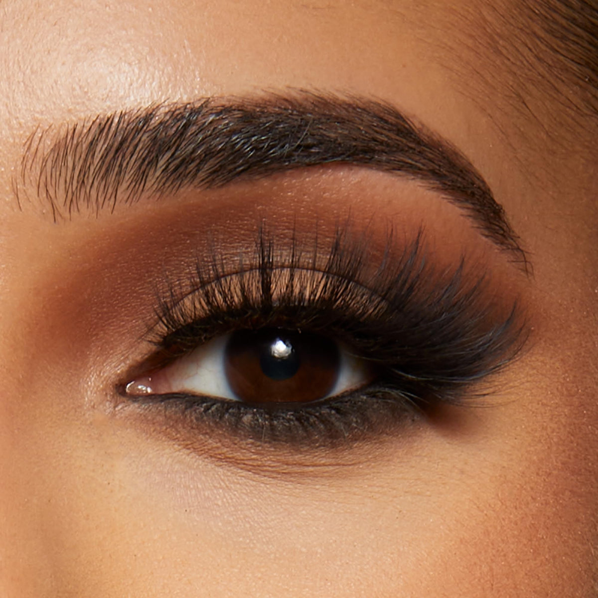 KISS close-up of long tapered fibers showing natural look and soft shine benefit realism
