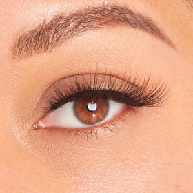 KISS Lash Couture beside coin to show 16mm length scale