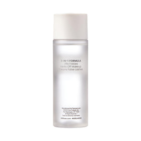 KISS bottle next to ruler illustrating 50 ml compact size for travel
