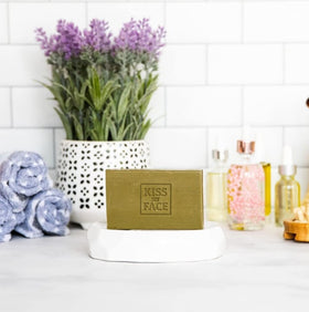 Kiss My Face bars styled on a bathroom shelf showing cruelty-free appeal