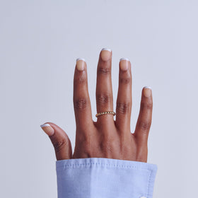 KISS swatched nails arranged by size to show variety and petite sizing benefit