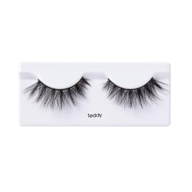 KISS Teddy shown in hand to display true size and lightweight benefit