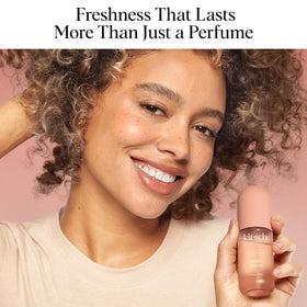 Kitsch mist sprayed onto hair delivering odor-neutralizing freshness
