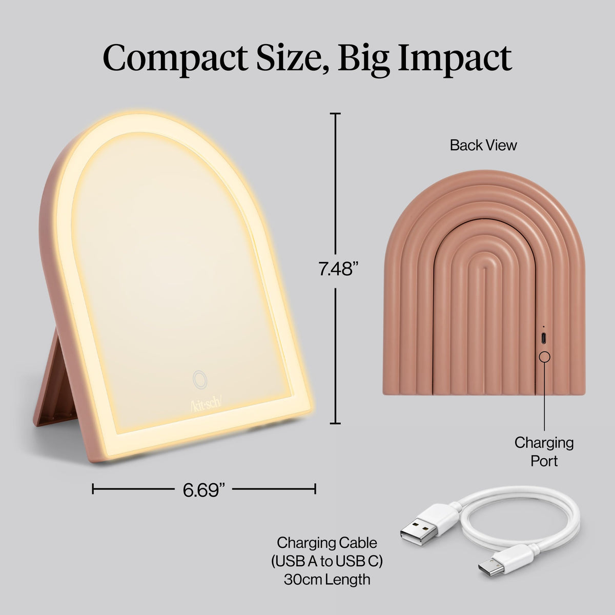 Kitsch mirror held in hand illustrating portable size for travel and touch-ups