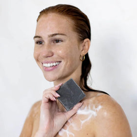 Kitsch charcoal soap on bathroom shelf showing organized, sustainable routine