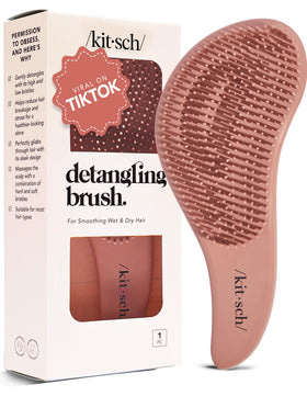 Kitsch detangler brush front view showing compact terracotta design and portability
