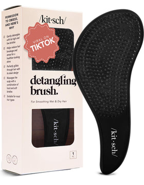 Kitsch front view of brush showing compact shape and easy grip for quick detangling