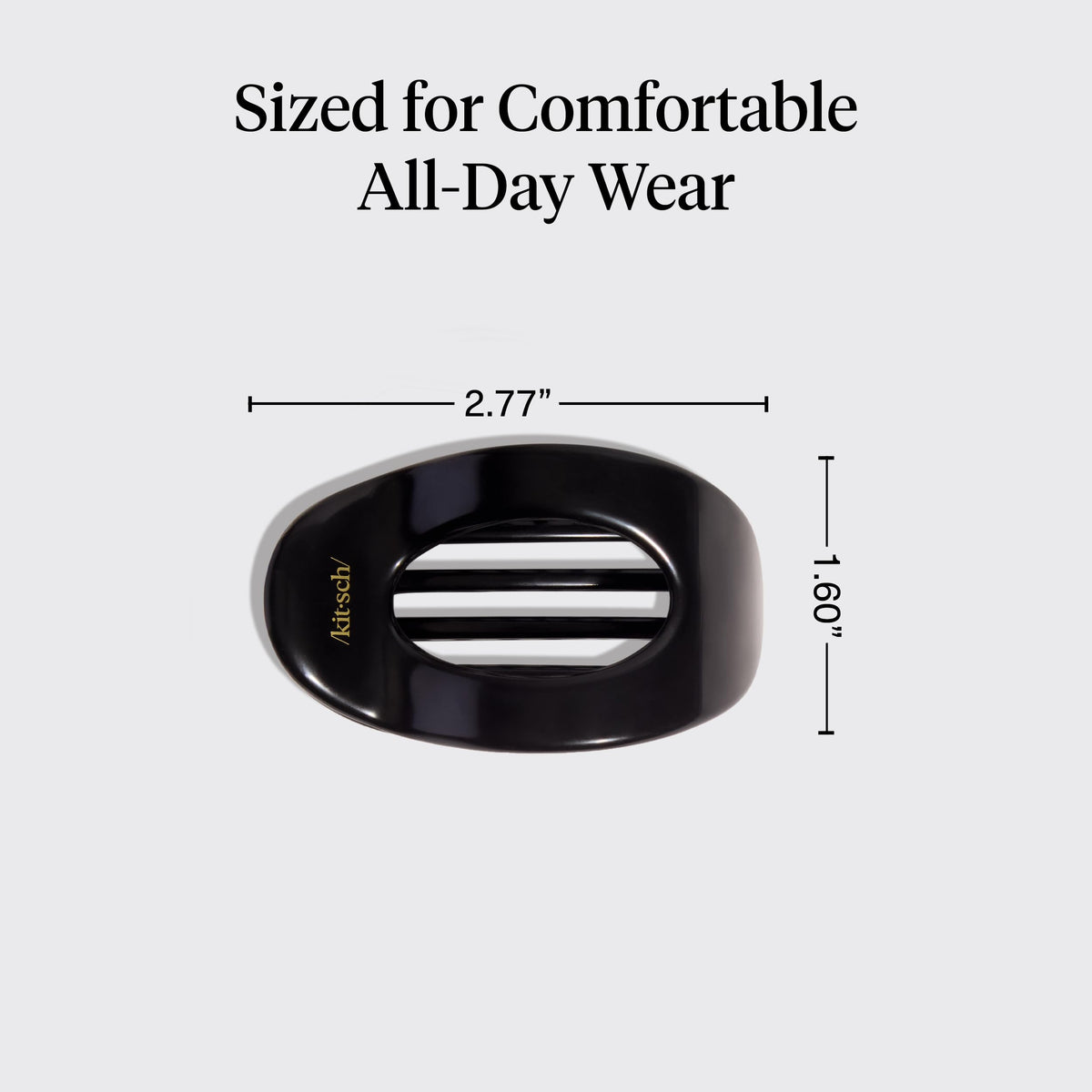 Kitsch clip next to hand showing compact size and portability
