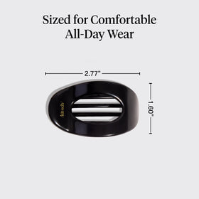 Kitsch clip next to hand showing compact size and portability