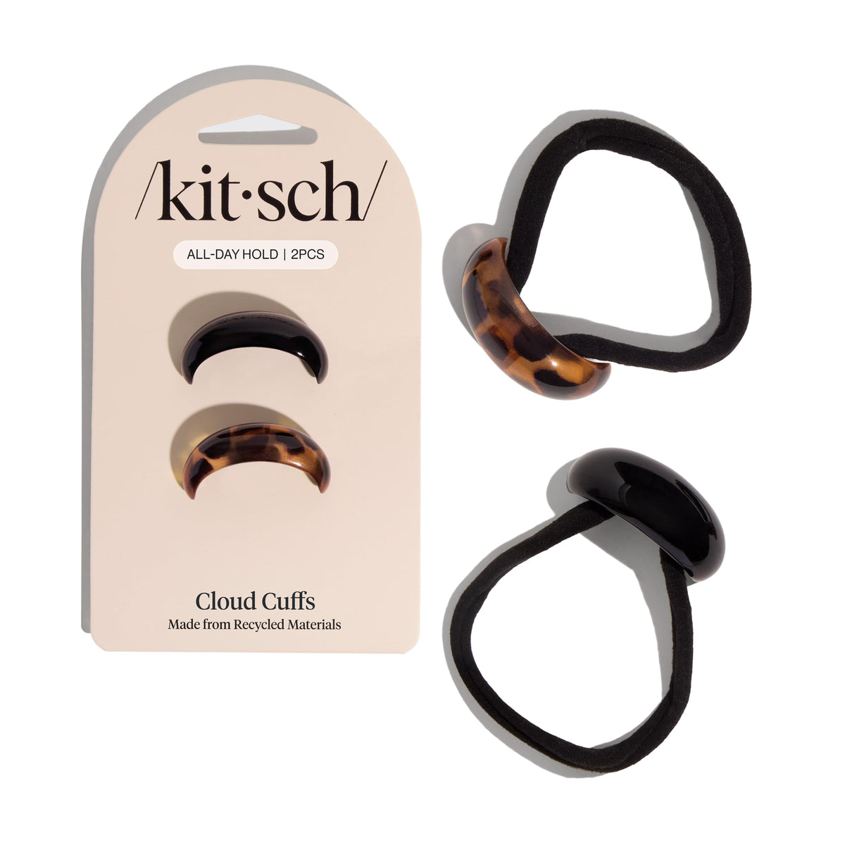 Kitsch front view of black and tortoise cuffs showing sleek finish and polished look