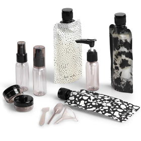 Kitsch front view of whole travel kit showing organized bottles and pouch for easy packing