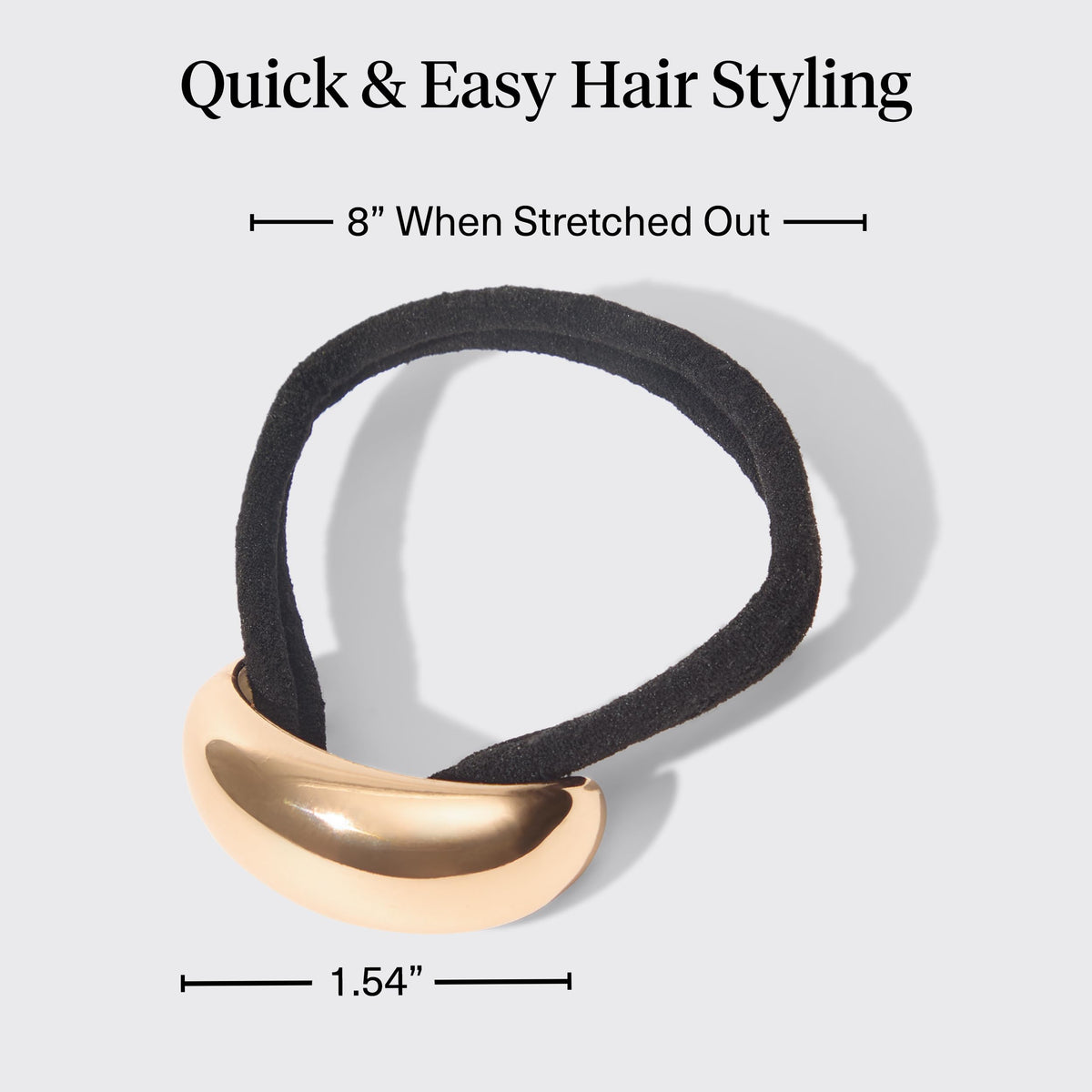 Kitsch gold hair cuff finishing a low bun for a refined everyday look