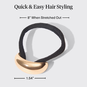 Kitsch gold hair cuff finishing a low bun for a refined everyday look