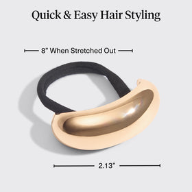 Kitsch gold hair cuff securing a braid for a refined look