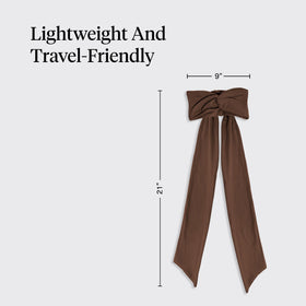 Kitsch headband packed in travel bag illustrating easy portability for trips
