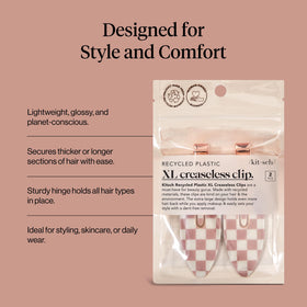 Kitsch holding a thick hair section to show strong grip and crease-free result