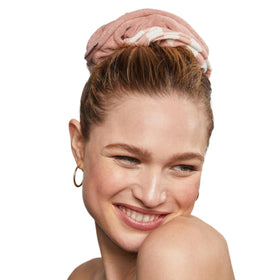 Kitsch scrunchie securing damp ponytail, demonstrating gentle hold and reduced dripping