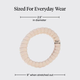 Kitsch hair tie securing a high ponytail demonstrating crease-free styling