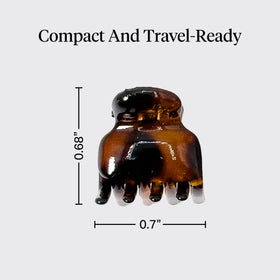 Kitsch clip beside a coin showing compact size for travel convenience