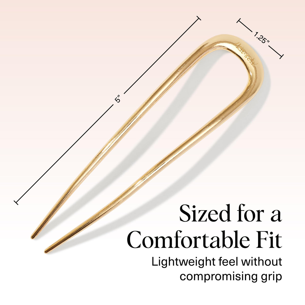 Kitsch pin scale next to hand to show compact travel-friendly size