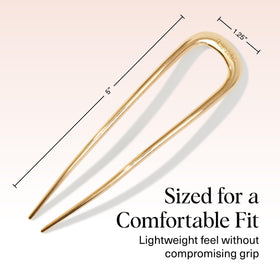 Kitsch pin scale next to hand to show compact travel-friendly size